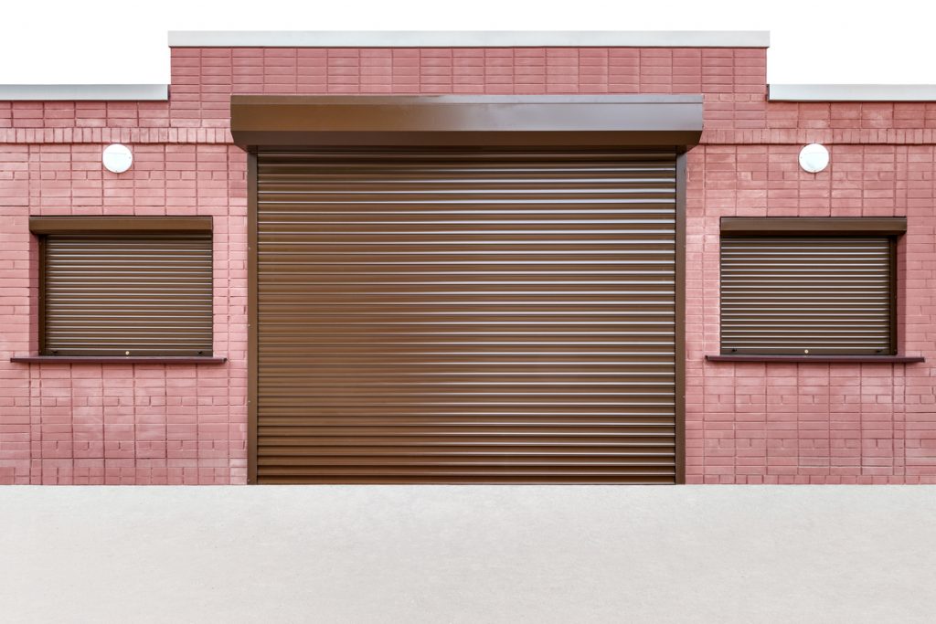 Closed door and windows of the small street cafe on white background.