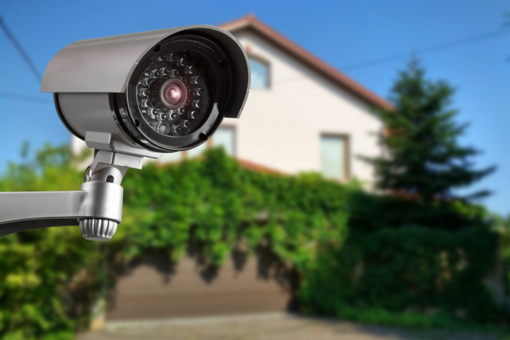 Security camera and private house on the background