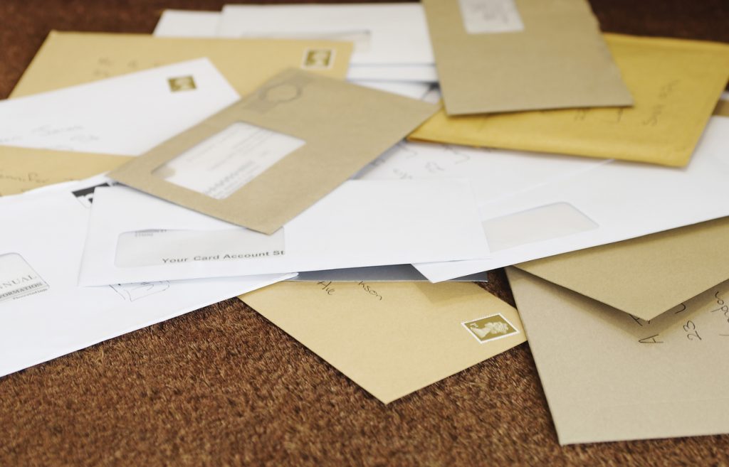 Pile Of Mail On Doormat - security risk